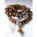 Mala tigrisszemmel, zafírral, vörös gránáttal