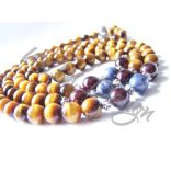 Mala tigrisszemmel, zafírral, vörös gránáttal